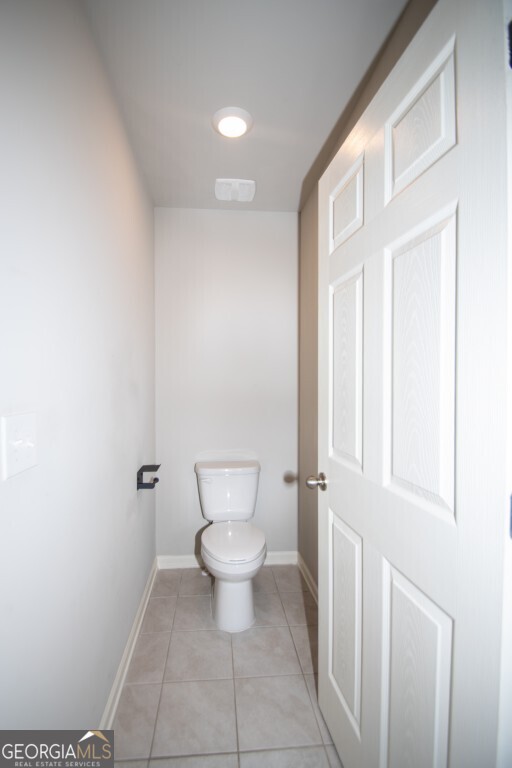8084 Louis Drive Locust Grove, GA 30248 - Photo 32 of 44 a bathroom with a toilet