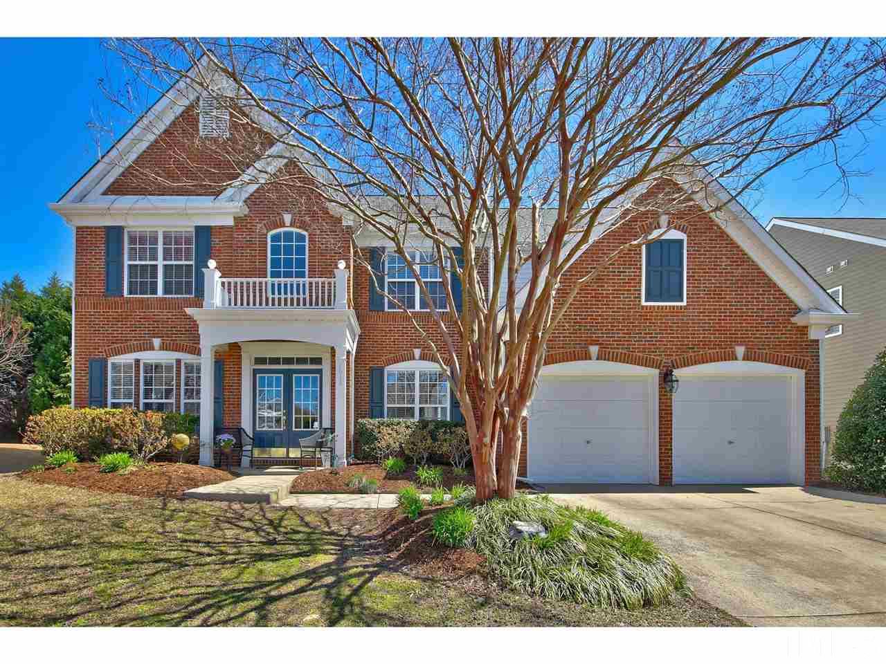 7616 Derek Drive Raleigh, NC 27613 - Photo 1 of 25 a front view of a house with a yard