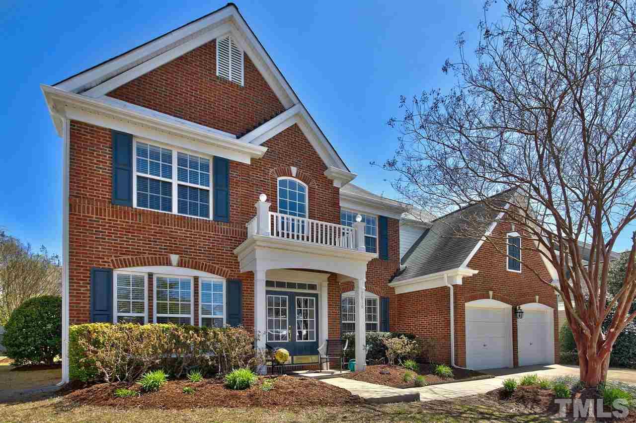 7616 Derek Drive Raleigh, NC 27613 - Photo 2 of 25 a front view of a house with a yard