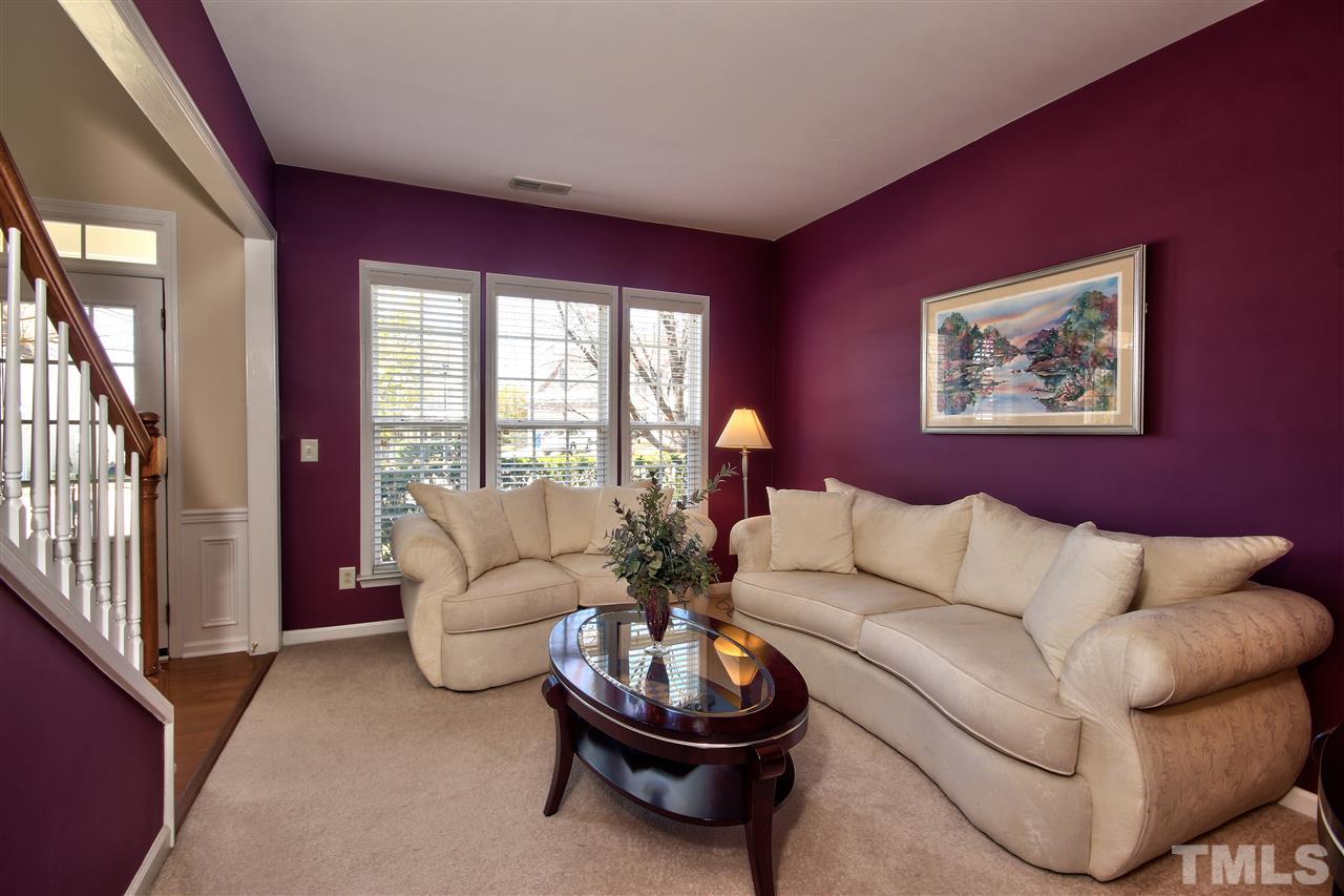 7616 Derek Drive Raleigh, NC 27613 - Photo 3 of 25 a living room with furniture and a large window