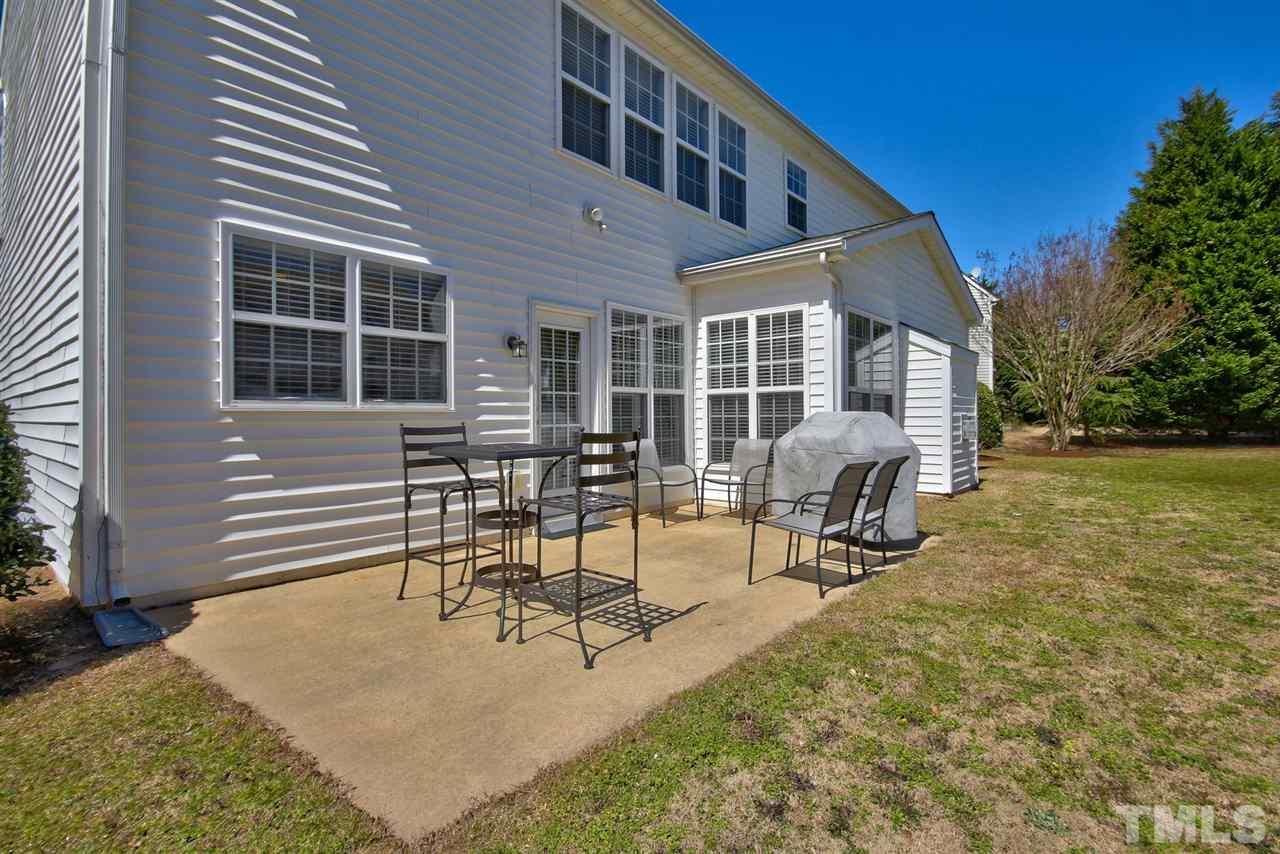 7616 Derek Drive Raleigh, NC 27613 - Photo 22 of 25 a view of a house with backyard and sitting area