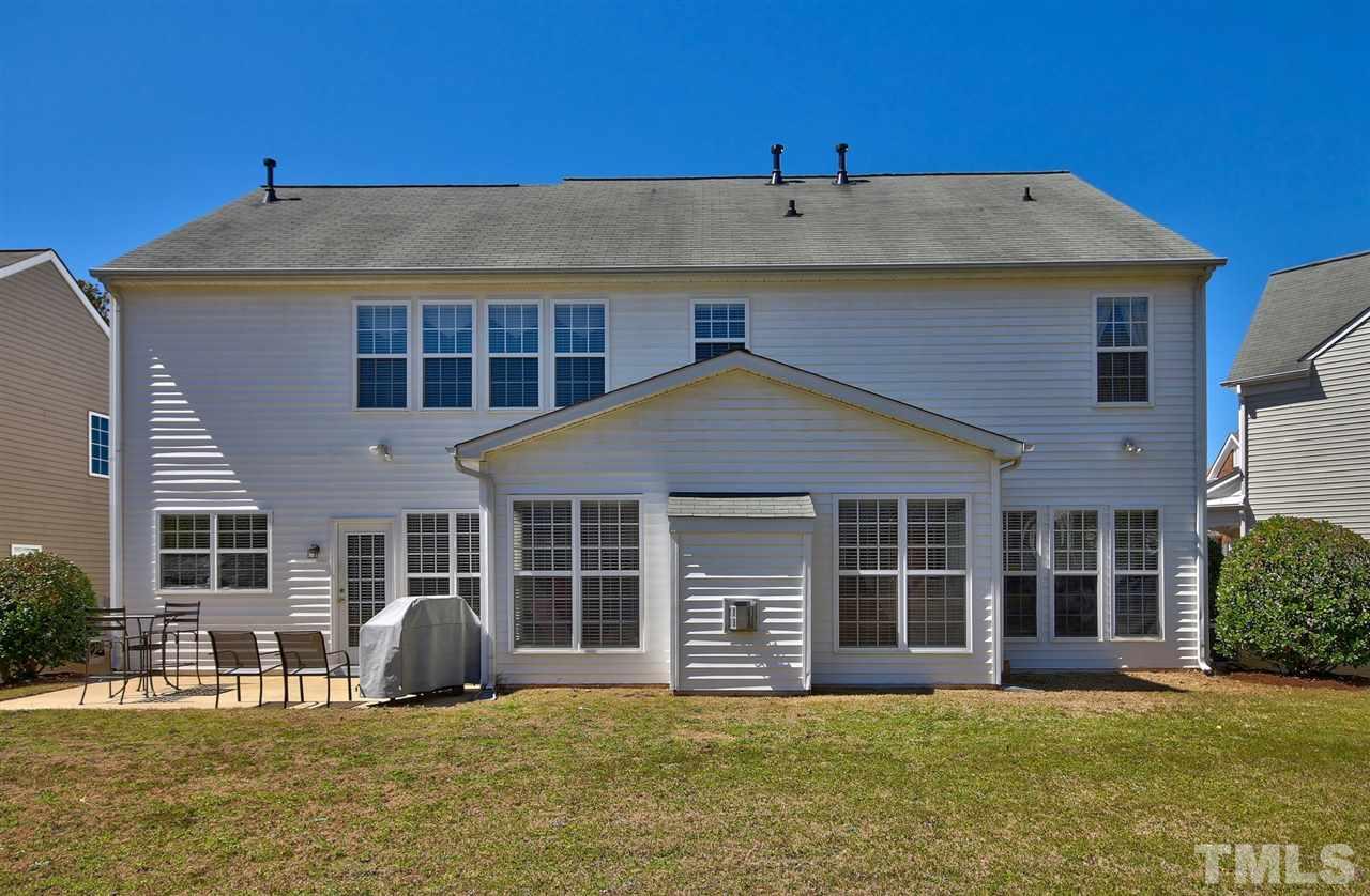 7616 Derek Drive Raleigh, NC 27613 - Photo 23 of 25 a house with swimming pool in front of it