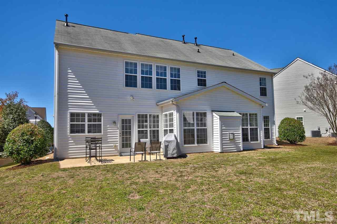7616 Derek Drive Raleigh, NC 27613 - Photo 24 of 25 a front view of a house with a yard