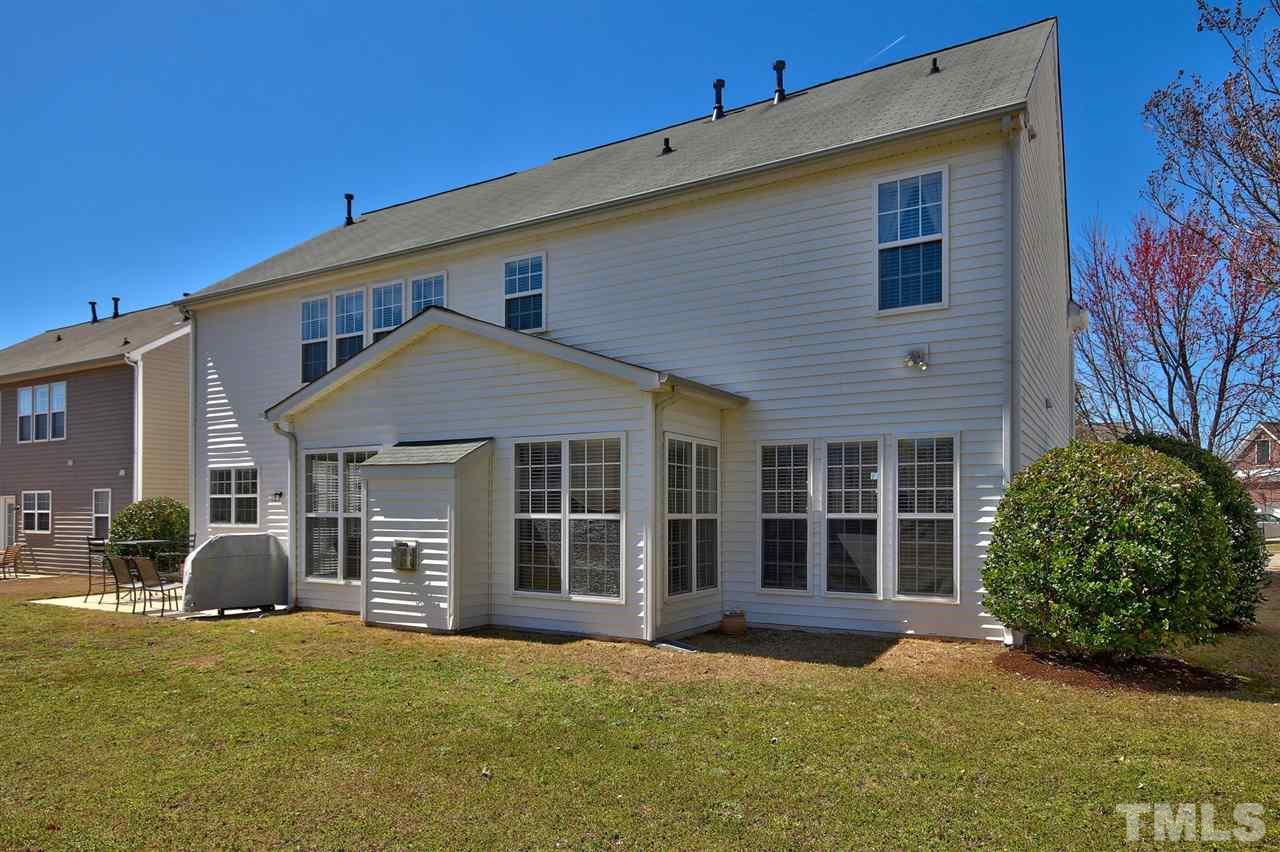 7616 Derek Drive Raleigh, NC 27613 - Photo 25 of 25 a view of a house with a garden and pathway