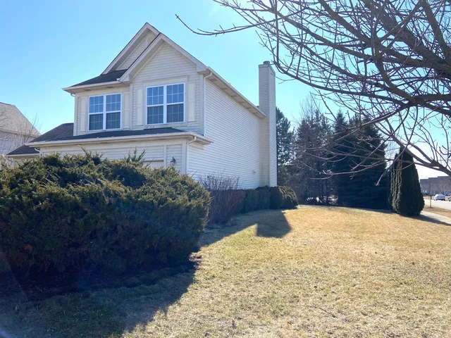 a view of a house with yard covered with snow in front of house