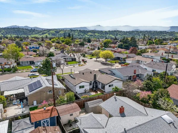 an aerial view of residential houses with outdoor space