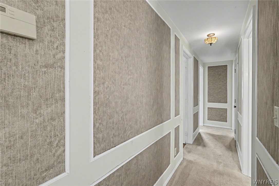 4685 Sawmill Road Clarence, NY 14031 - Photo 16 of 38 Calm and cohesive hallway leading to the back bedrooms