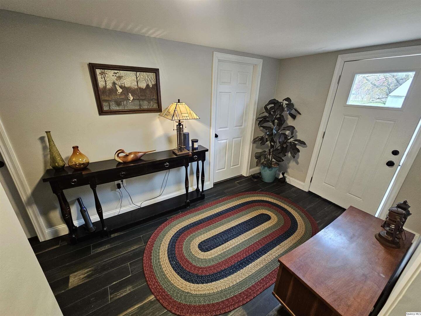 306 Walker Street Ursa, IL 62376 - Photo 14 of 20 a room with gym equipment and a window