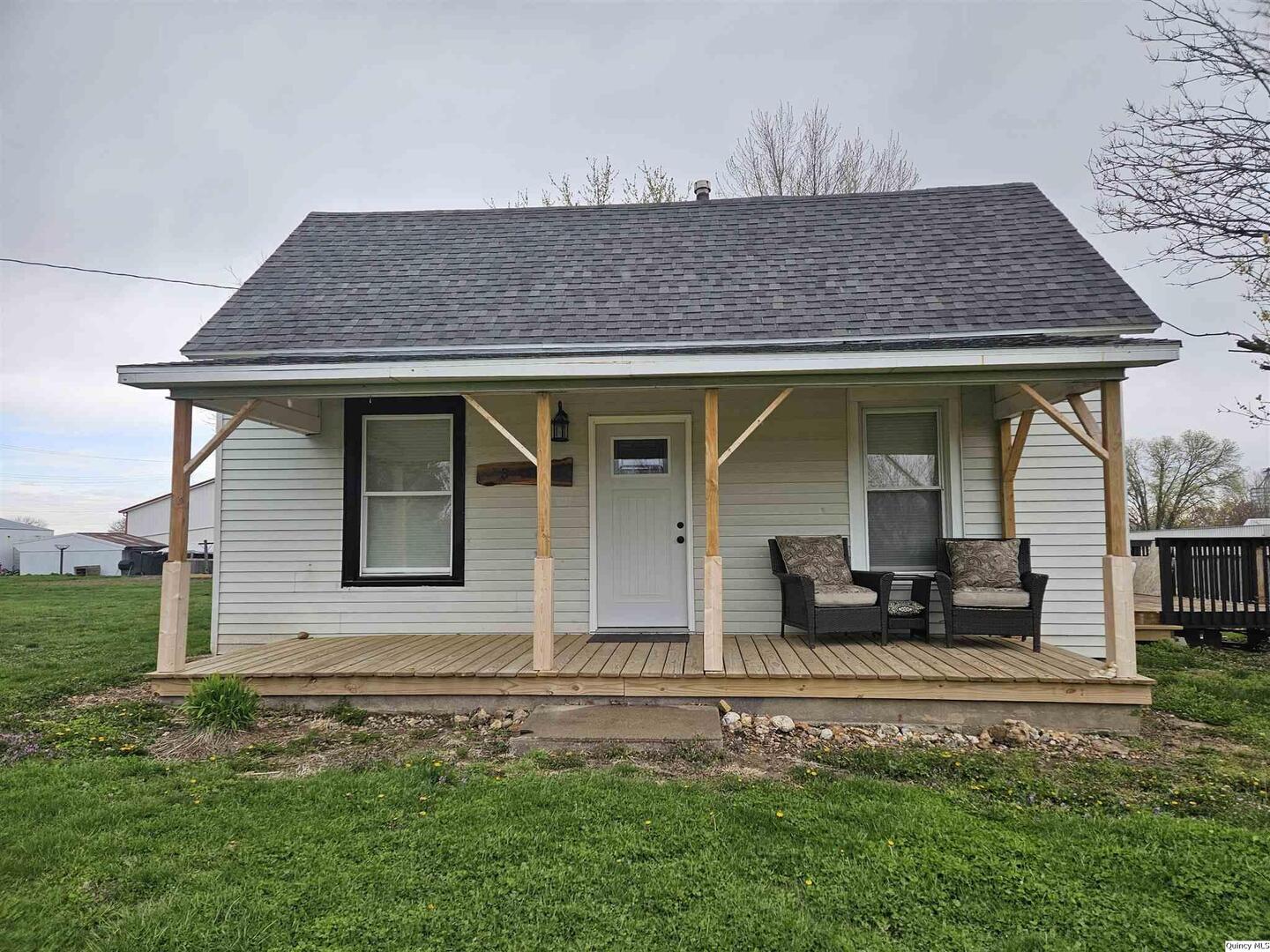 306 Walker Street Ursa, IL 62376 - Photo 2 of 20 front view of a house with a yard