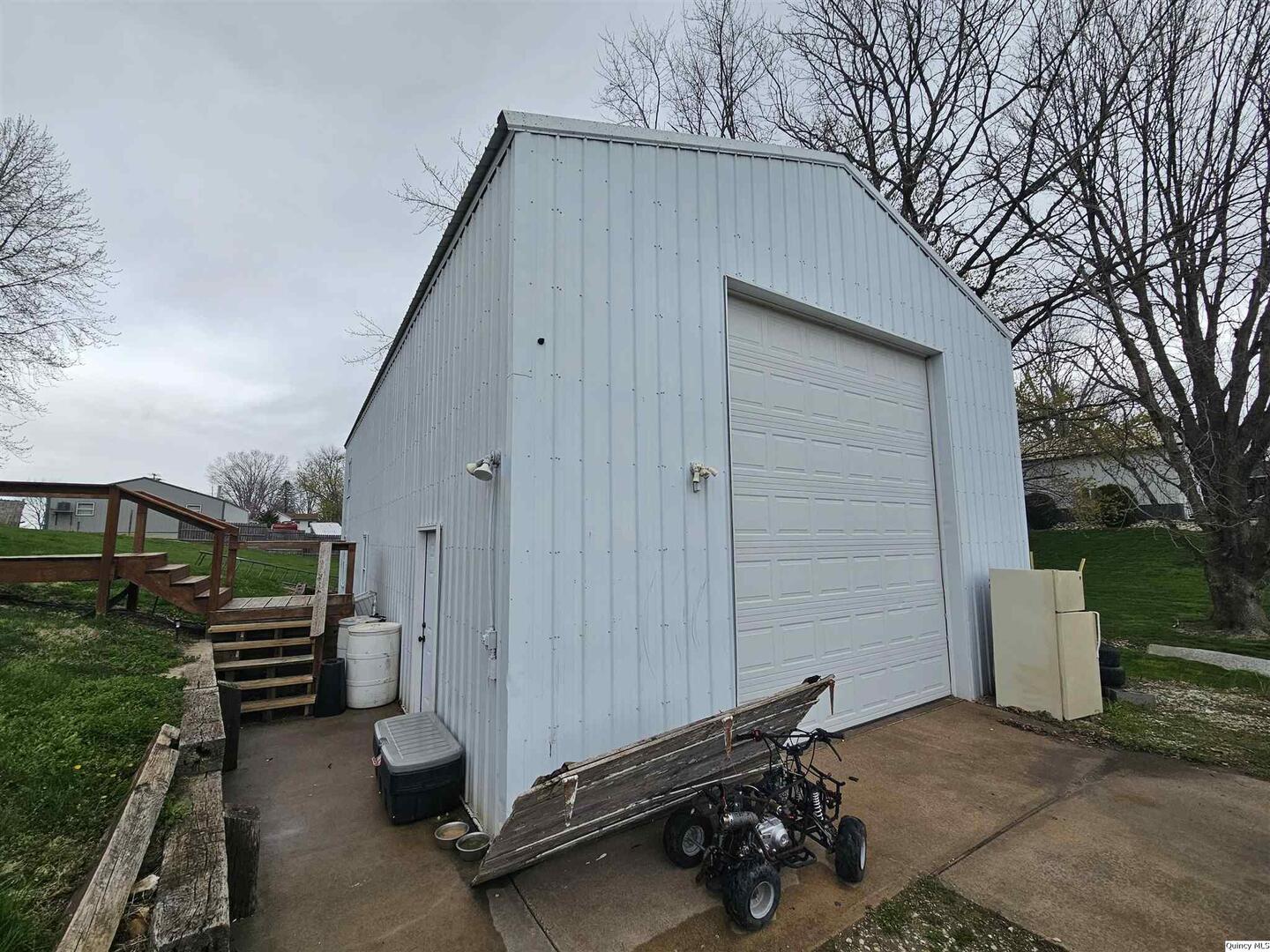 306 Walker Street Ursa, IL 62376 - Photo 4 of 20 a backyard of a house with barbeque oven and outdoor seating