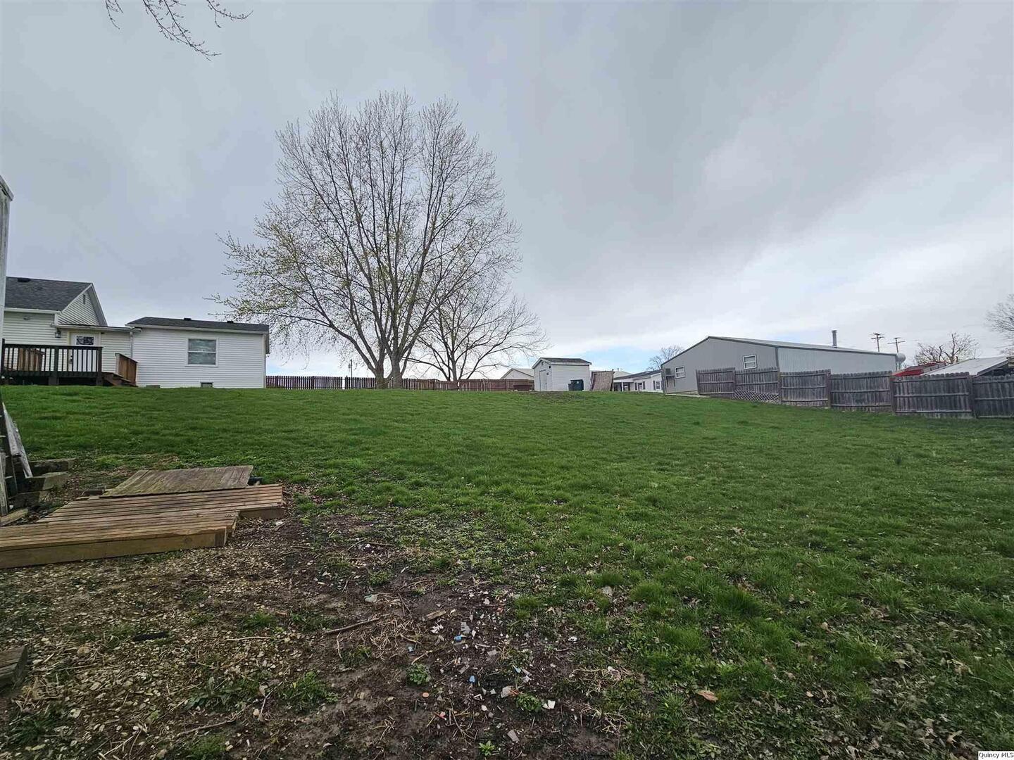 306 Walker Street Ursa, IL 62376 - Photo 5 of 20 a view of a house with a yard