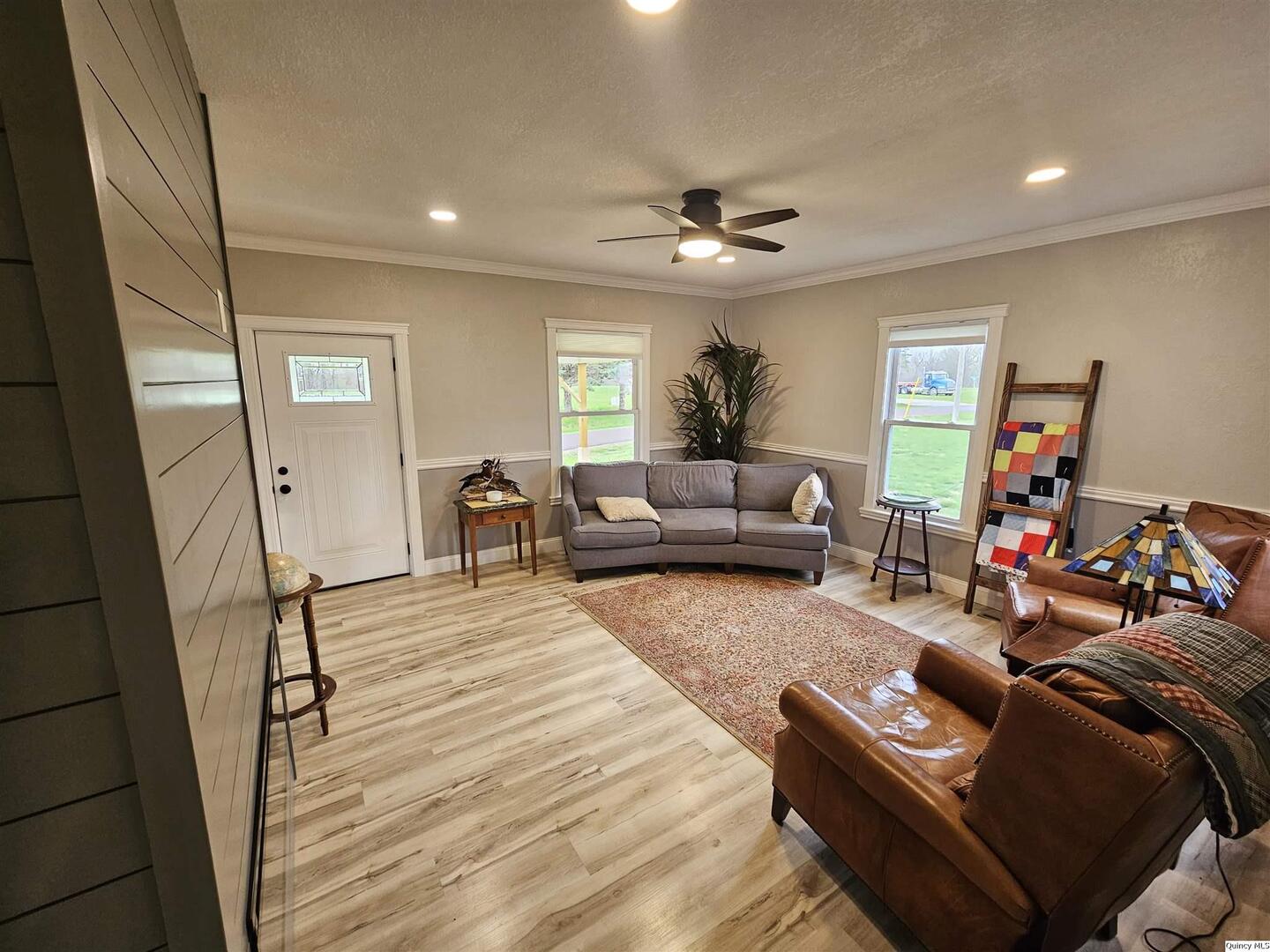 306 Walker Street Ursa, IL 62376 - Photo 8 of 20 a living room with furniture and a wooden floor