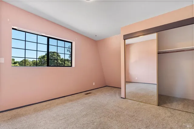 an empty room with a large window