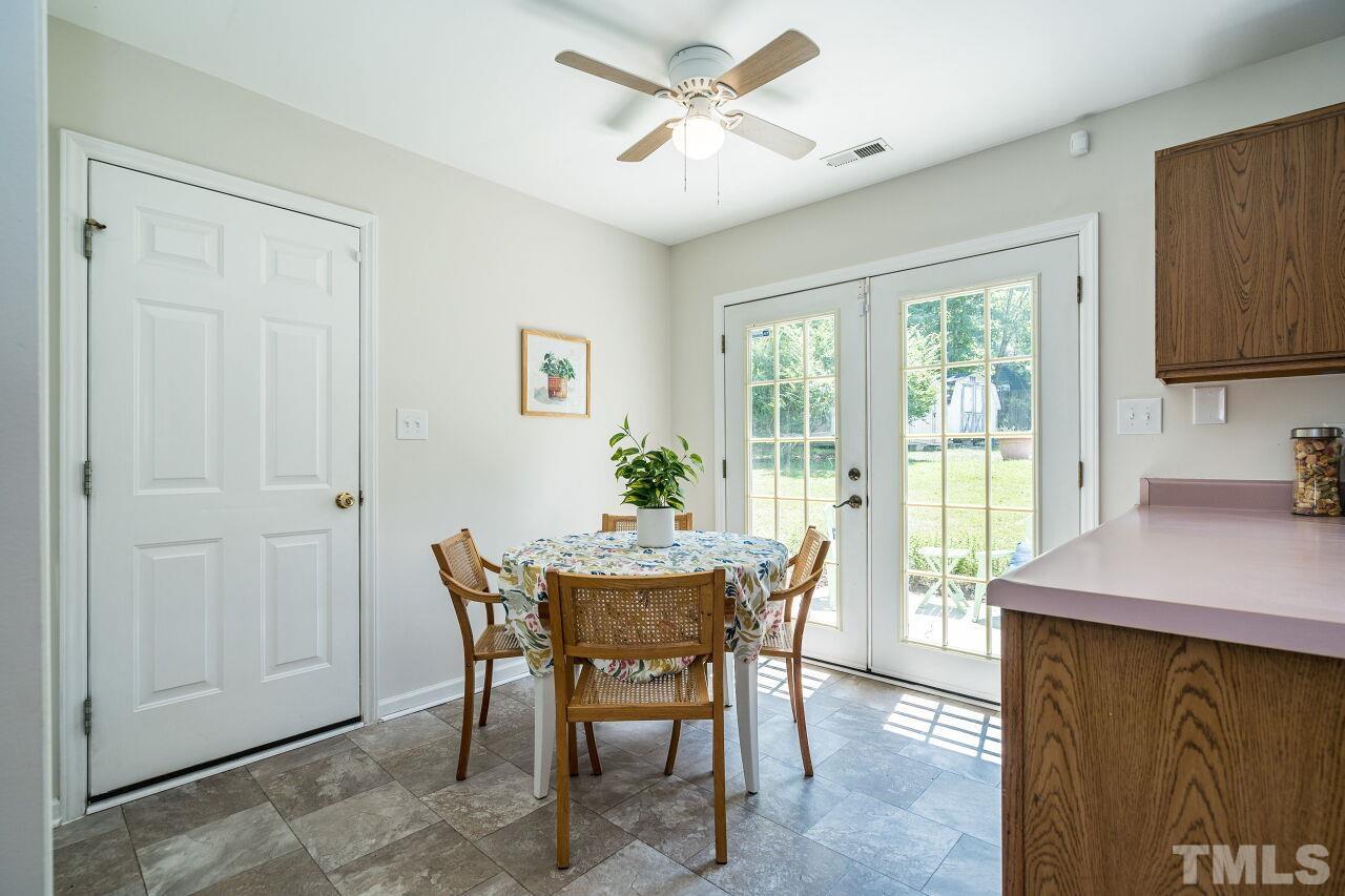 2 Halsey Place Durham, NC 27707 - Photo 15 of 27 a dining room with furniture a rug and a potted plant