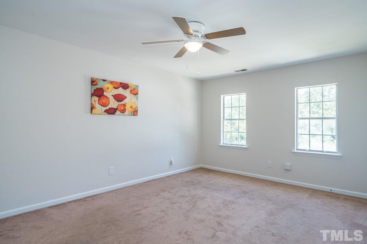 2 Halsey Place Durham, NC 27707 - Photo 16 of 27 an empty room with window and ceiling fan