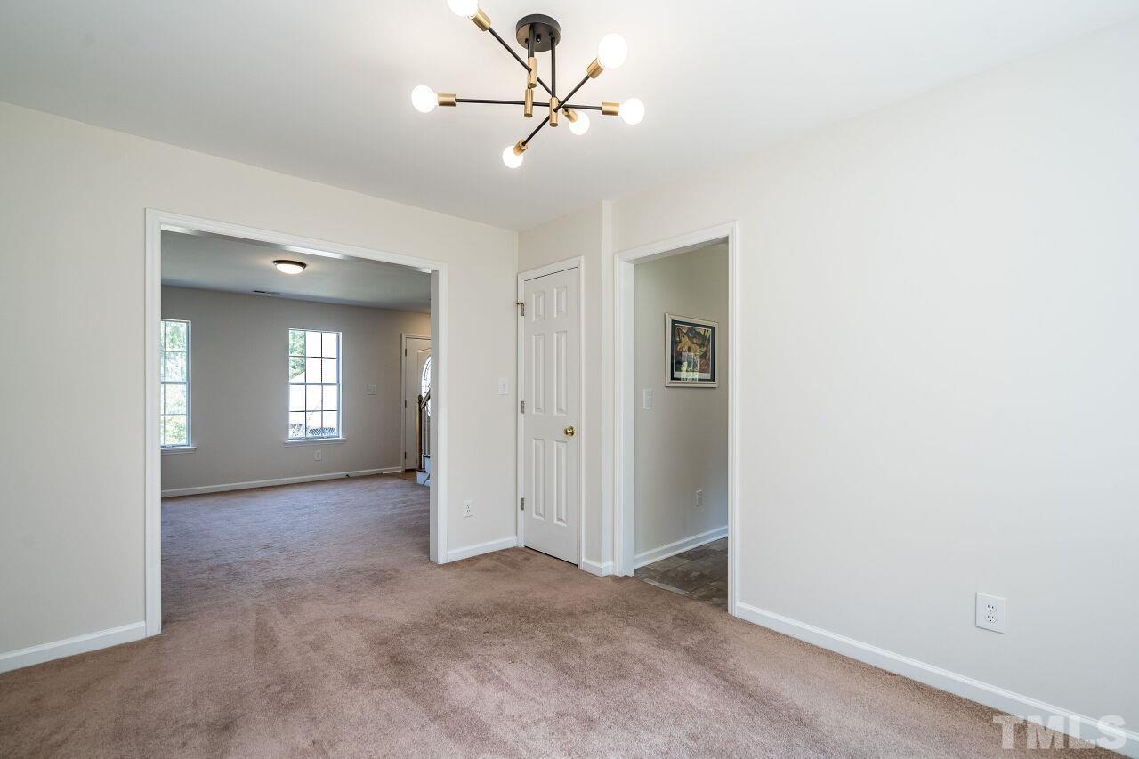 2 Halsey Place Durham, NC 27707 - Photo 10 of 27 a view of a livingroom with a ceiling fan and window