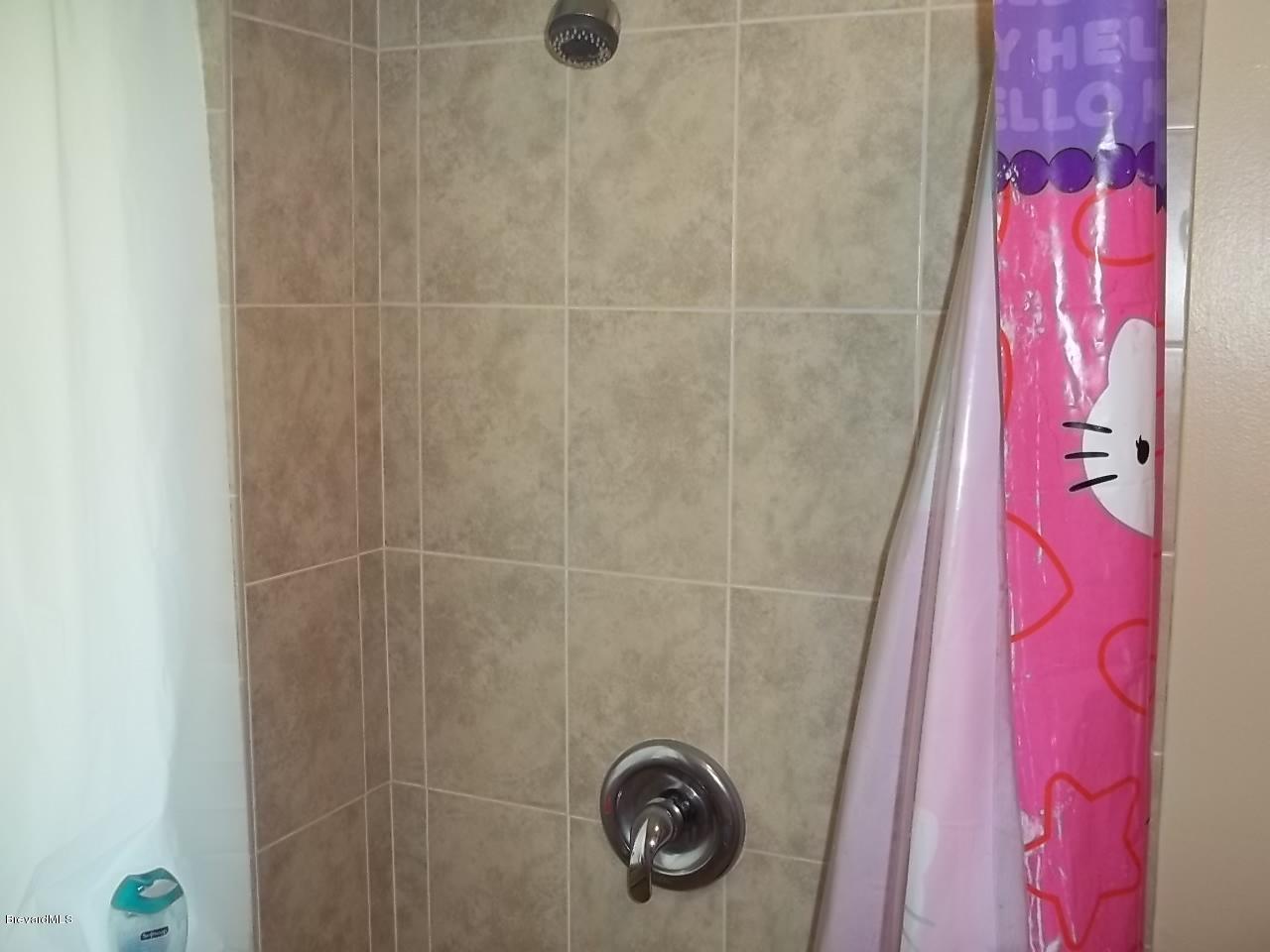 1140 Gary Hunt Road, Unit A Cocoa, FL 32926 - Photo 25 of 35 all tile master shower down stairs