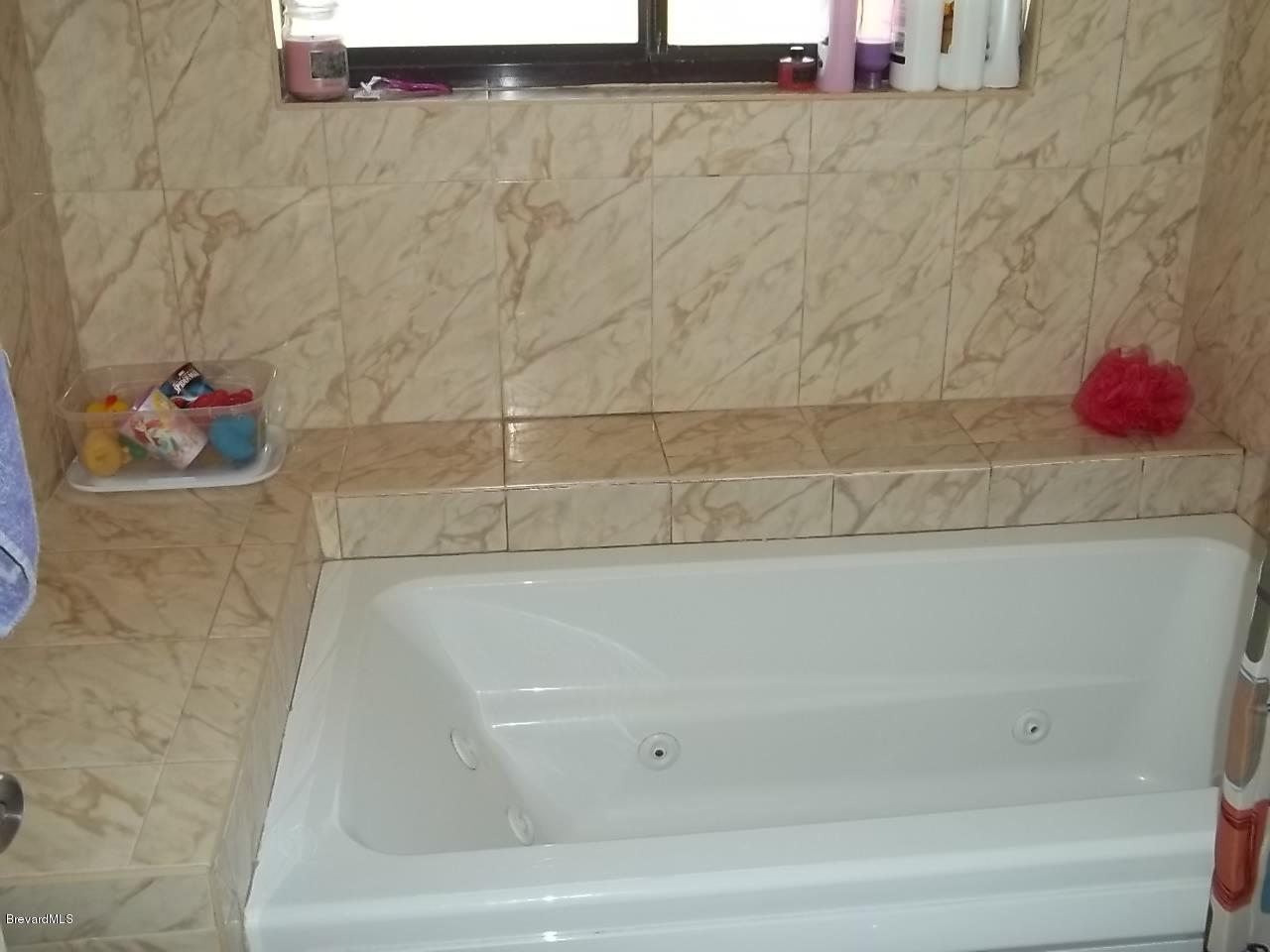 1140 Gary Hunt Road, Unit A Cocoa, FL 32926 - Photo 27 of 35 bathtub and shower upstaris