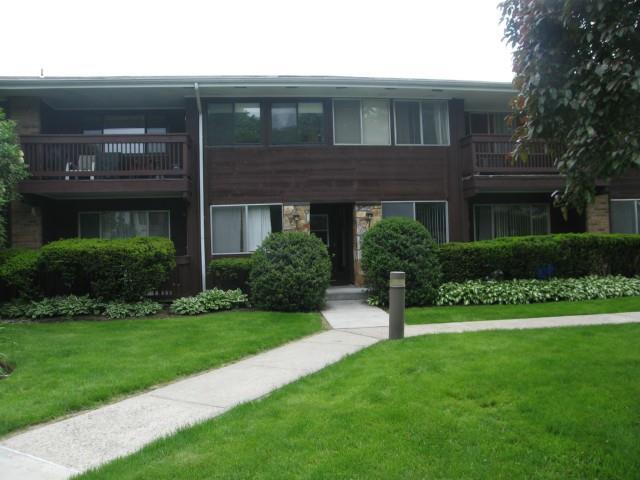 154 Cold Spring Road, Unit 17 Stamford, CT 06905 - Photo 1 of 1 a view of a house with a yard and plants