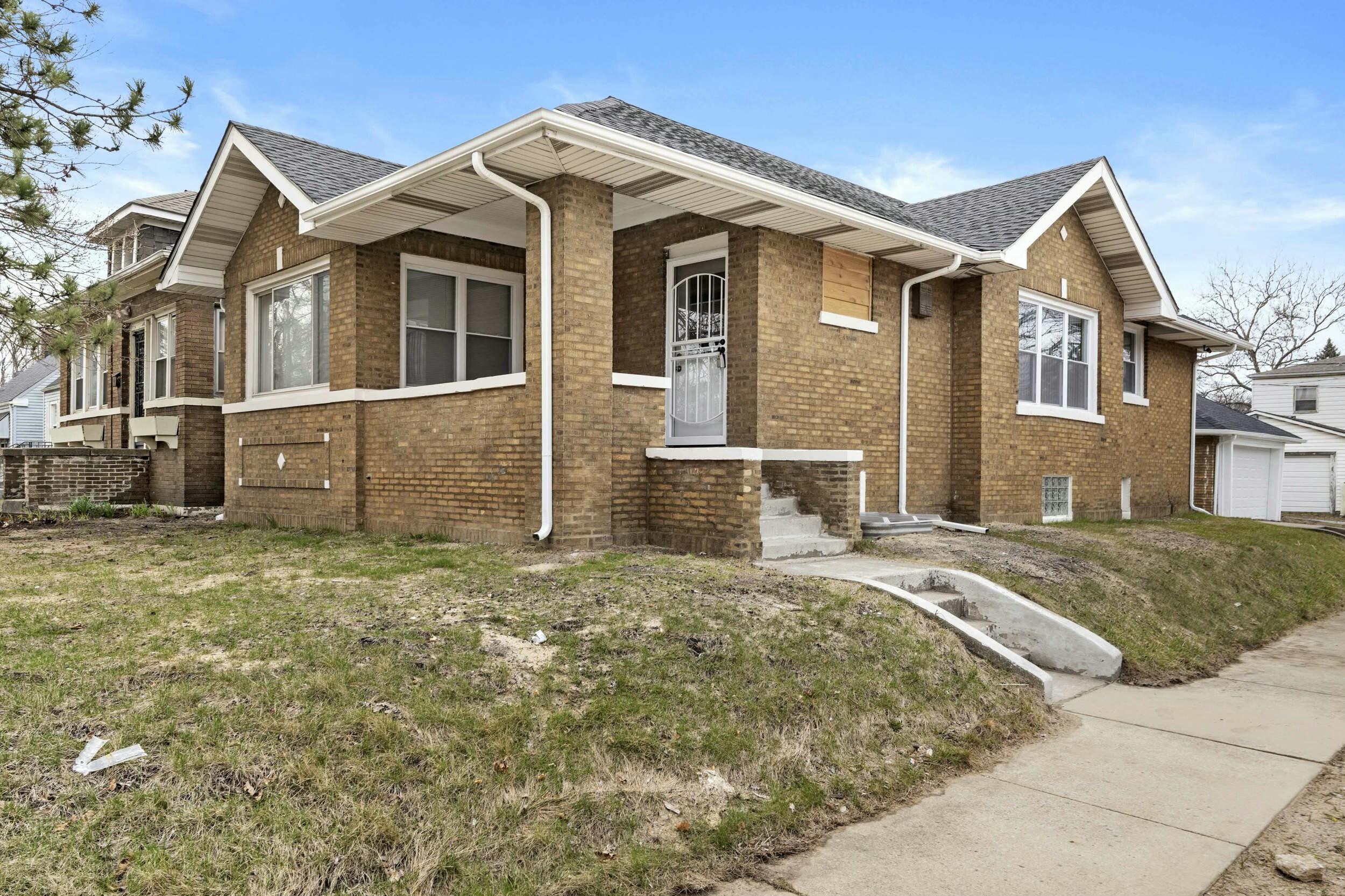 800 Garfield Street Gary, IN 46404 - Photo 1 of 23 a front view of a house with a yard