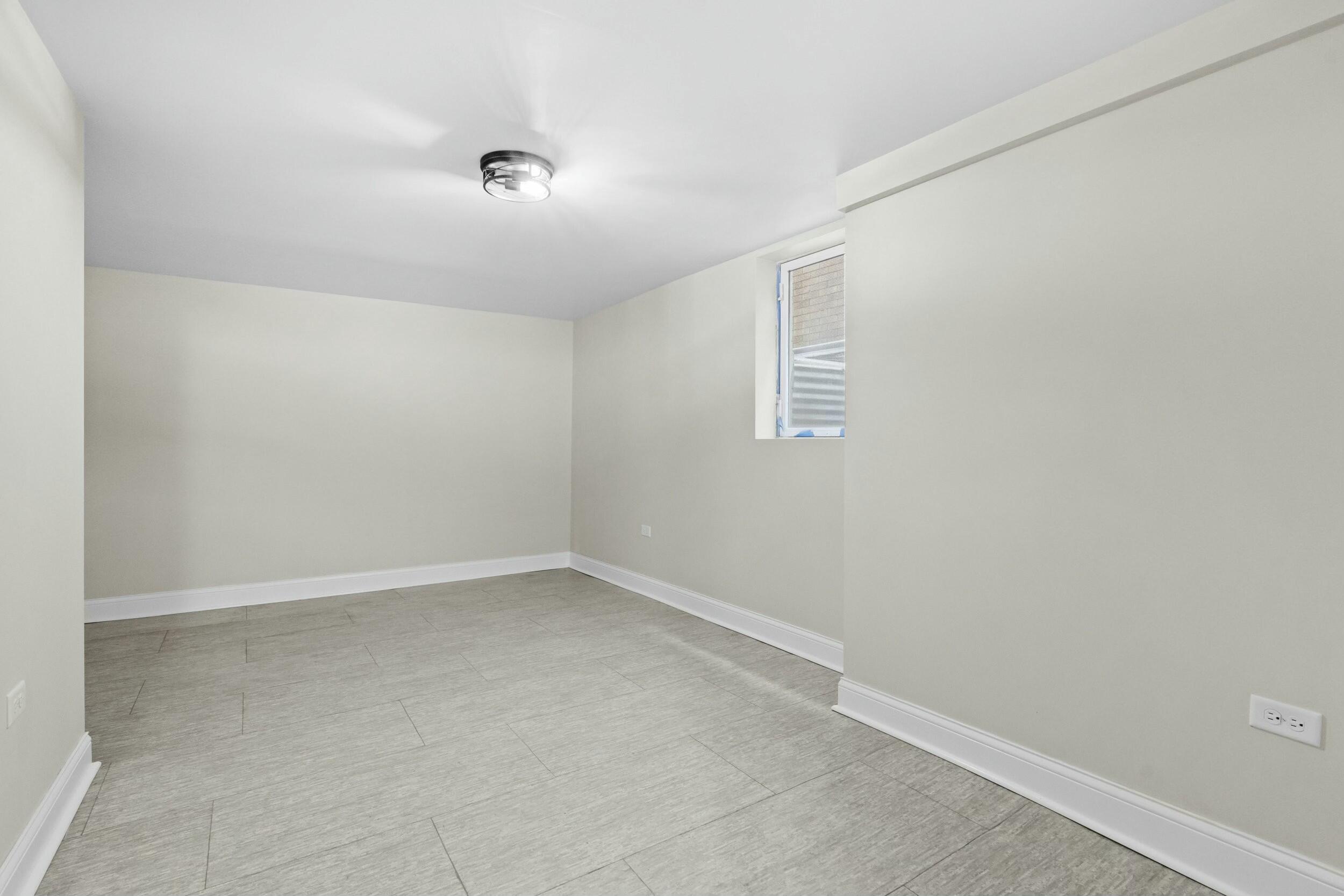 800 Garfield Street Gary, IN 46404 - Photo 21 of 23 an empty room with a empty space and windows