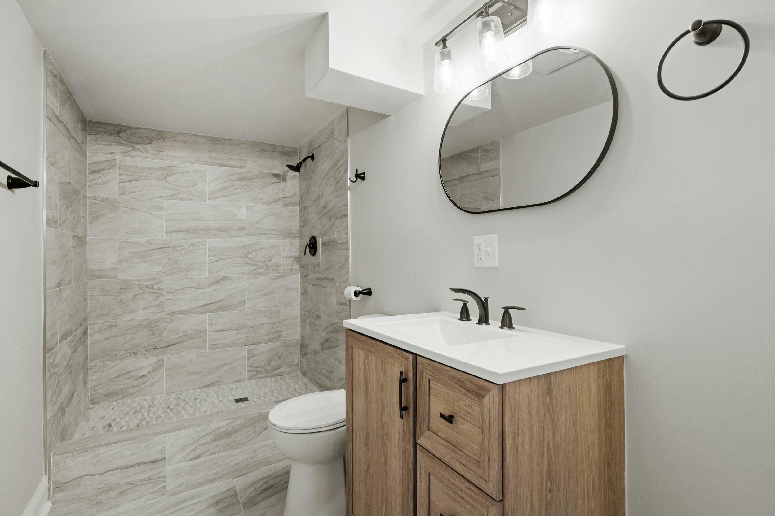800 Garfield Street Gary, IN 46404 - Photo 23 of 23 a bathroom with a sink a toilet and a mirror