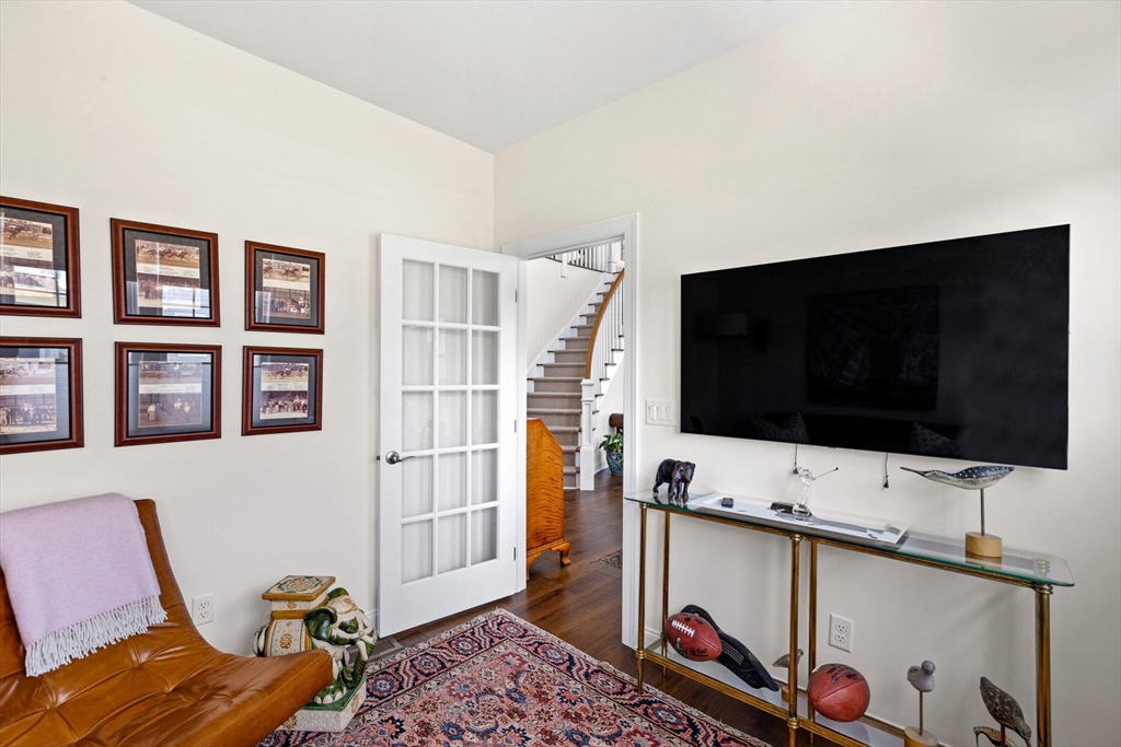 148 Hatherly Road, Unit 148 Scituate, MA 02066 - Photo 16 of 42 a living room with furniture and a flat screen tv
