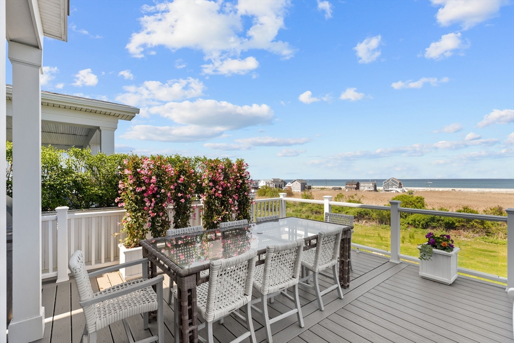 148 Hatherly Road, Unit 148 Scituate, MA 02066 - Photo 19 of 42 a view of a chairs and table on the terrace