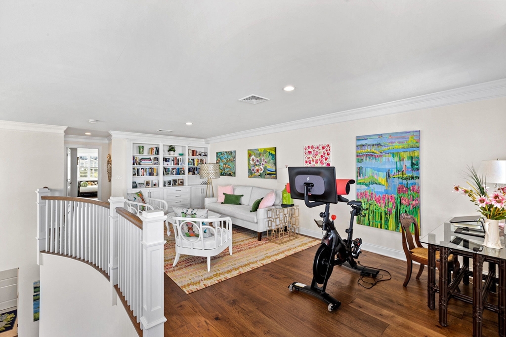 148 Hatherly Road, Unit 148 Scituate, MA 02066 - Photo 24 of 42 a living room with furniture and a flat screen tv