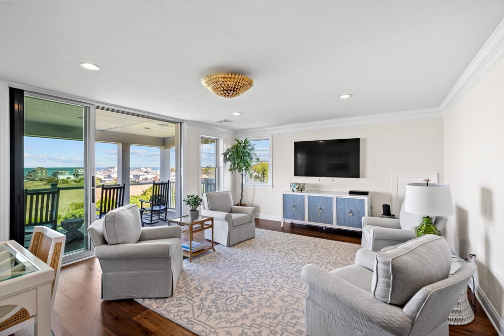 148 Hatherly Road, Unit 148 Scituate, MA 02066 - Photo 25 of 42 a living room with furniture and a flat screen tv