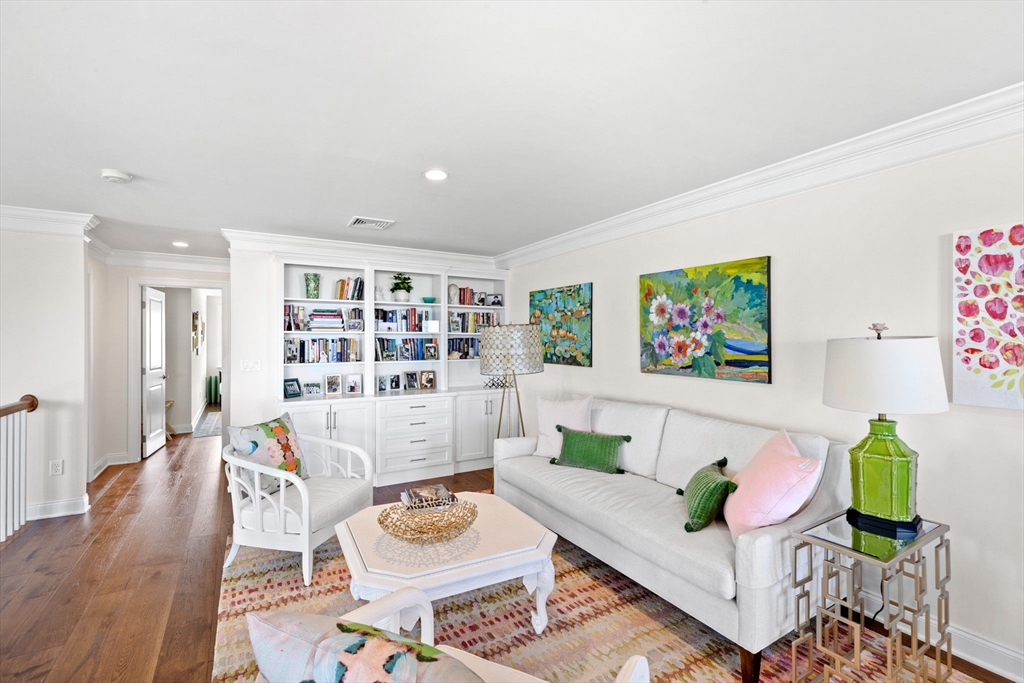 148 Hatherly Road, Unit 148 Scituate, MA 02066 - Photo 26 of 42 a living room with furniture and a wooden floor