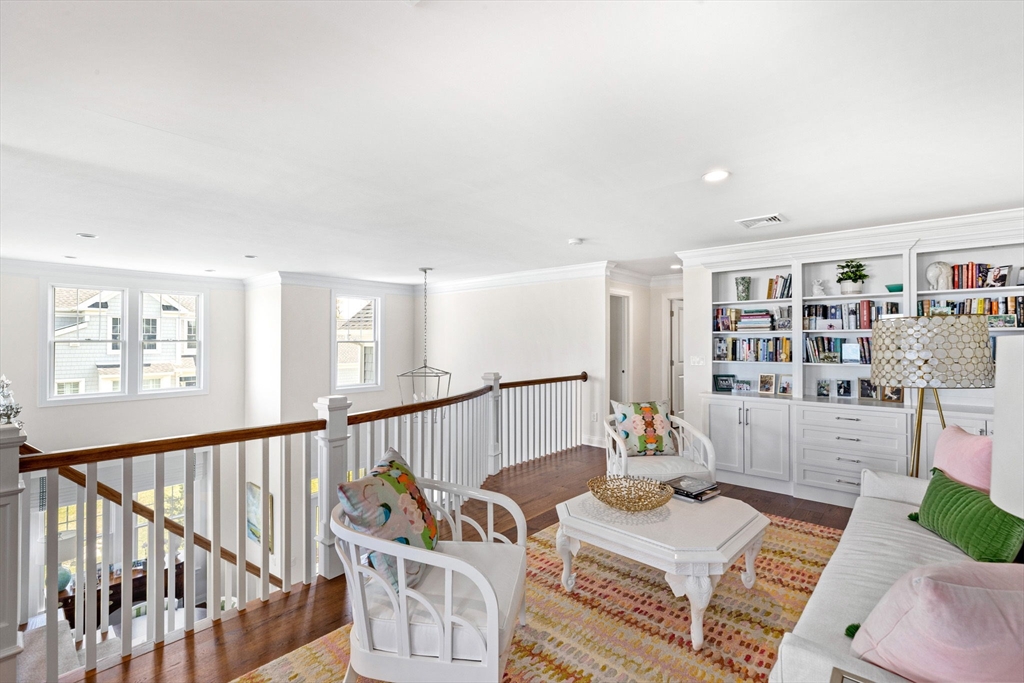 148 Hatherly Road, Unit 148 Scituate, MA 02066 - Photo 27 of 42 a living room with furniture and book shelf