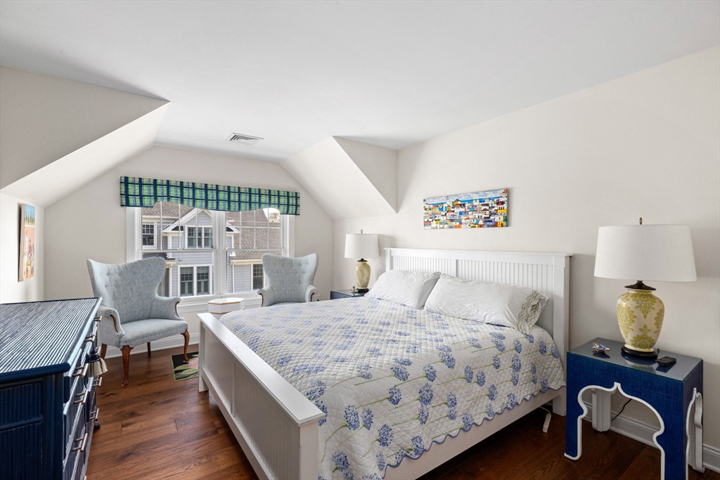 148 Hatherly Road, Unit 148 Scituate, MA 02066 - Photo 30 of 42 a bedroom with a bed and wooden floor