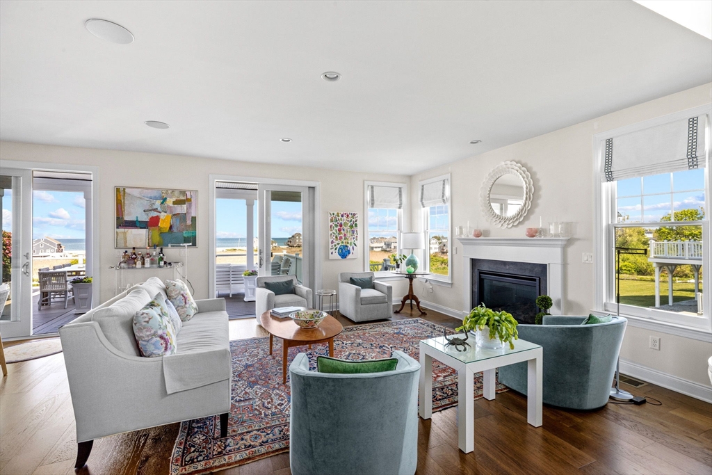 148 Hatherly Road, Unit 148 Scituate, MA 02066 - Photo 3 of 42 a living room with fireplace furniture and a window
