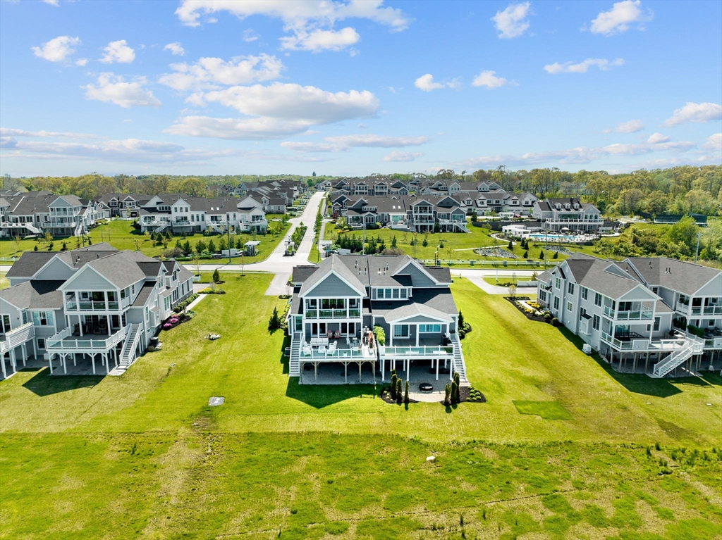 148 Hatherly Road, Unit 148 Scituate, MA 02066 - Photo 40 of 42 a view of a swimming pool with lawn chairs