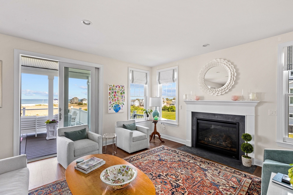 148 Hatherly Road, Unit 148 Scituate, MA 02066 - Photo 4 of 42 a living room with furniture and a fireplace