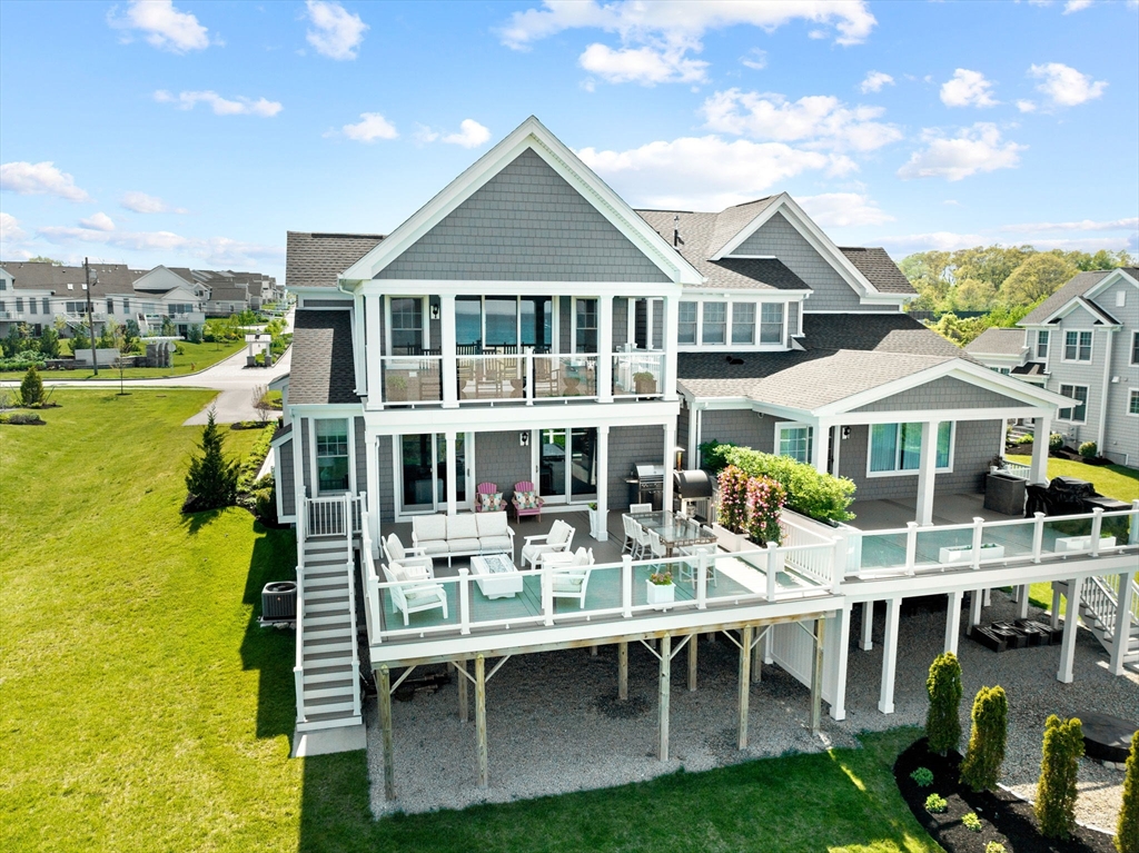 148 Hatherly Road, Unit 148 Scituate, MA 02066 - Photo 41 of 42 a front view of a house with swimming pool having outdoor seating