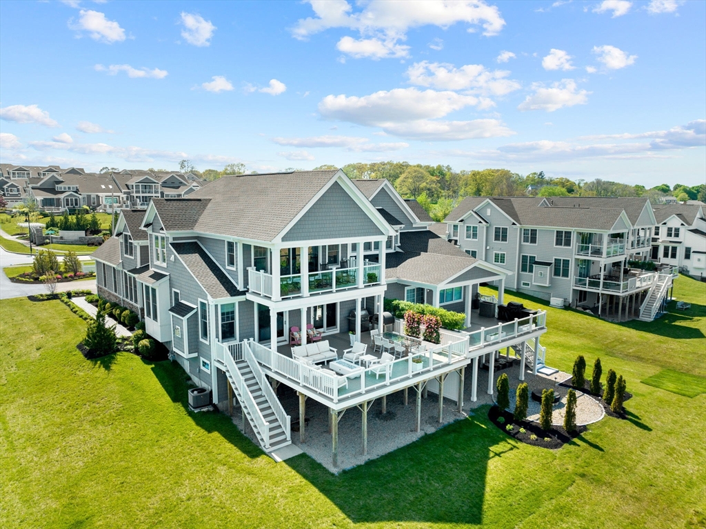 148 Hatherly Road, Unit 148 Scituate, MA 02066 - Photo 42 of 42 a aerial view of a house with a big yard and large trees