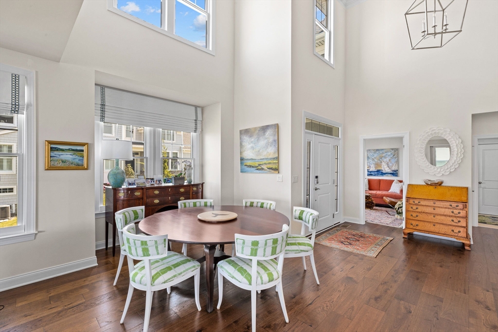 148 Hatherly Road, Unit 148 Scituate, MA 02066 - Photo 5 of 42 a view of a dining room with furniture and wooden floor