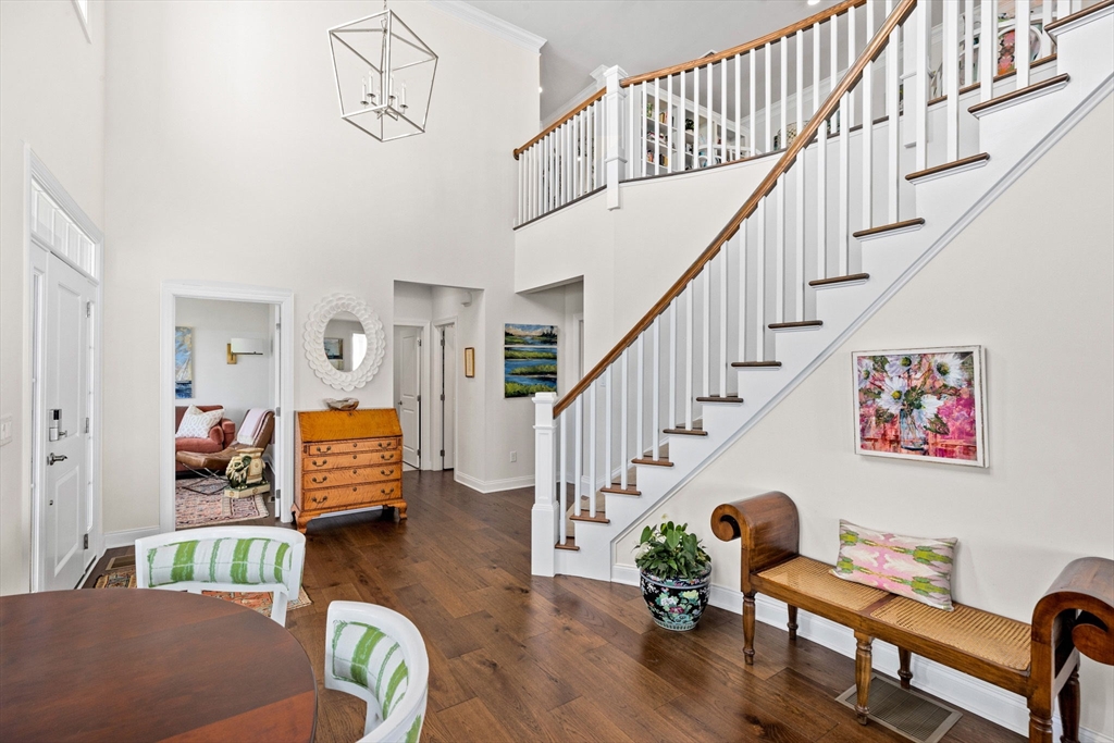 148 Hatherly Road, Unit 148 Scituate, MA 02066 - Photo 6 of 42 a living room with furniture and stairs