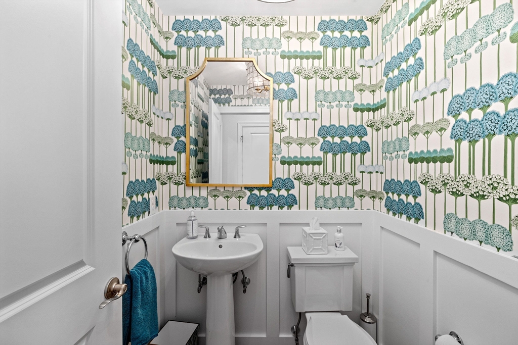 148 Hatherly Road, Unit 148 Scituate, MA 02066 - Photo 7 of 42 a bathroom with a sink and mirror