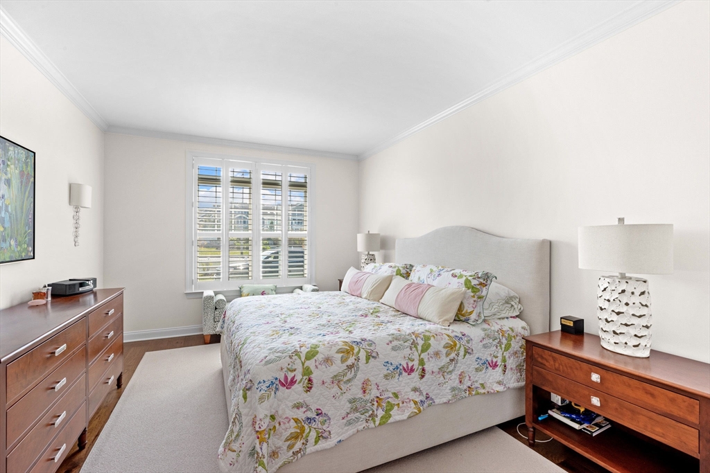 148 Hatherly Road, Unit 148 Scituate, MA 02066 - Photo 8 of 42 a bedroom with a bed and a window