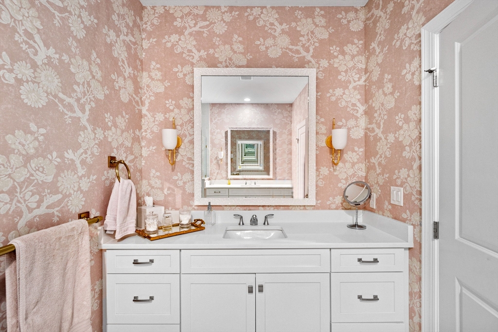 148 Hatherly Road, Unit 148 Scituate, MA 02066 - Photo 9 of 42 a bathroom with a sink and a mirror