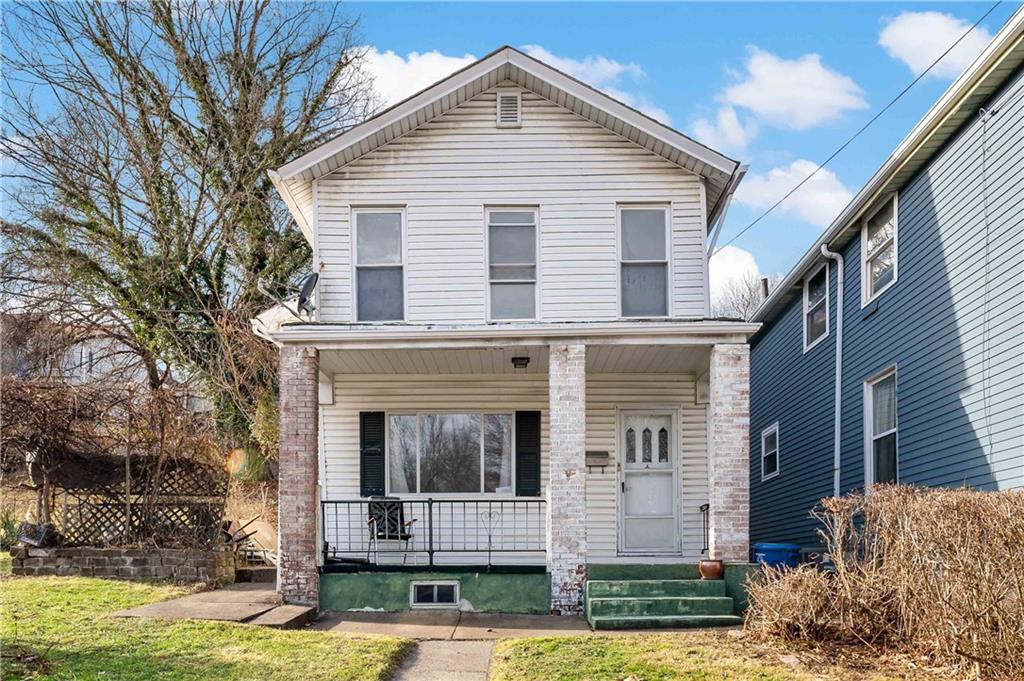 308 Merrimac Street Pittsburgh, PA 15211 - Photo 1 of 43 a view of a brick house with large windows