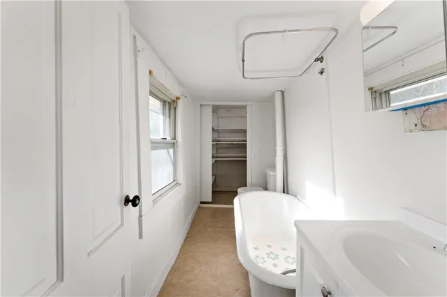 a bathroom with a bathtub and shower