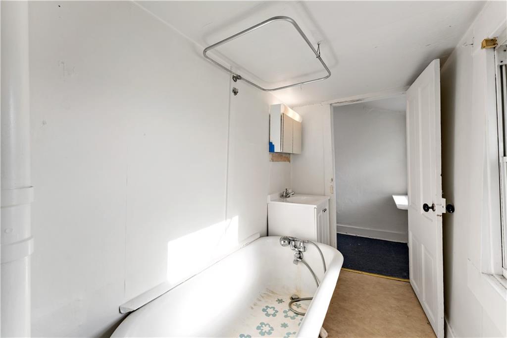 308 Merrimac Street Pittsburgh, PA 15211 - Photo 20 of 43 a bathroom with a bathtub and shower