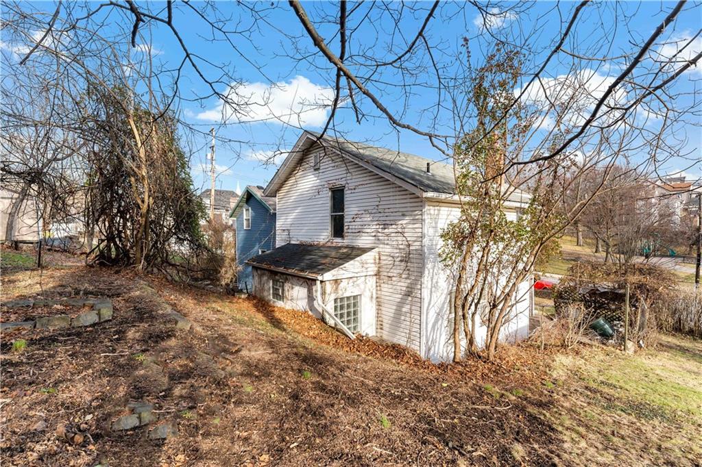 308 Merrimac Street Pittsburgh, PA 15211 - Photo 30 of 43 a front view of a house with a yard