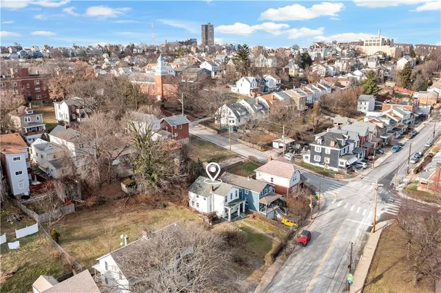 an aerial view of residential houses with outdoor space