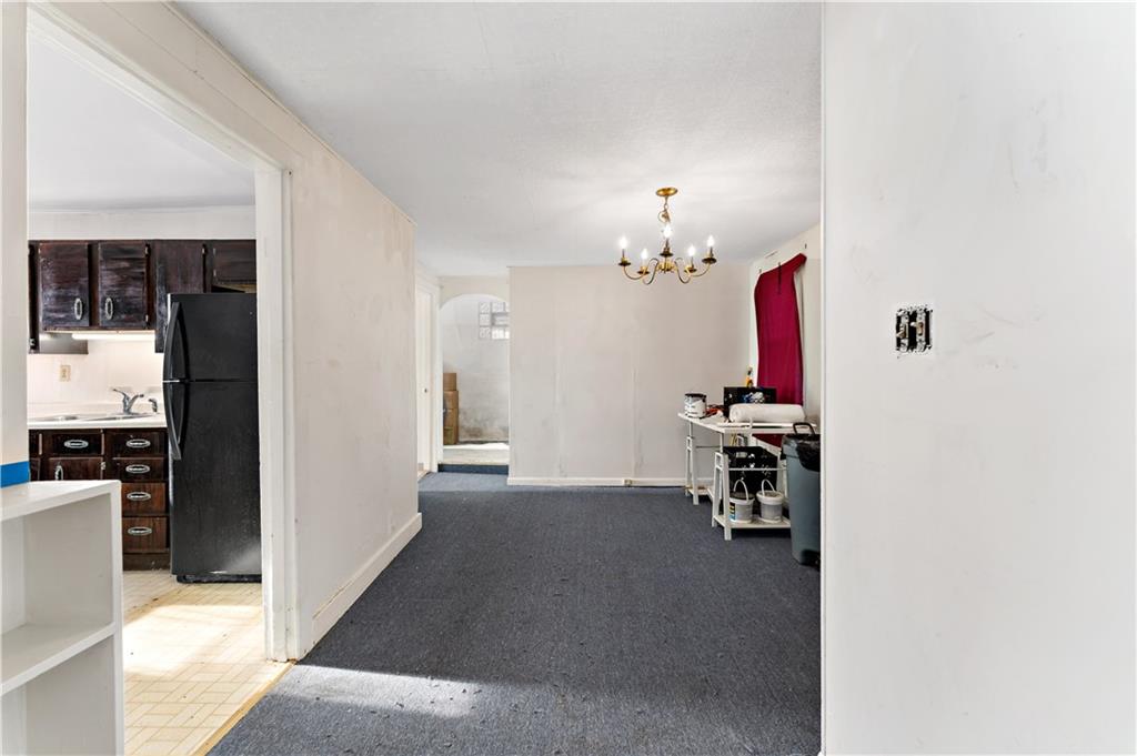 308 Merrimac Street Pittsburgh, PA 15211 - Photo 4 of 43 a view of a workspace with furniture and a kitchen