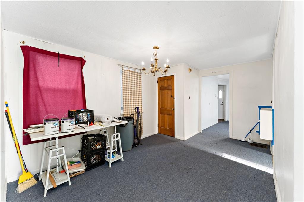 308 Merrimac Street Pittsburgh, PA 15211 - Photo 5 of 43 a view of a room with furniture and a chandelier